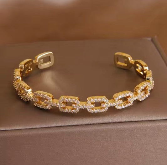 Elegant Golden Stainless Steel Bracelet with Embedded Crystals